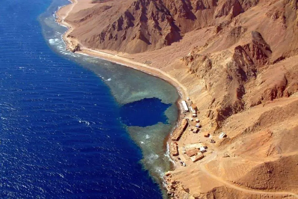 Blue Hole diving site in Dahab, Egypt with a scuba diver exploring the Red Sea